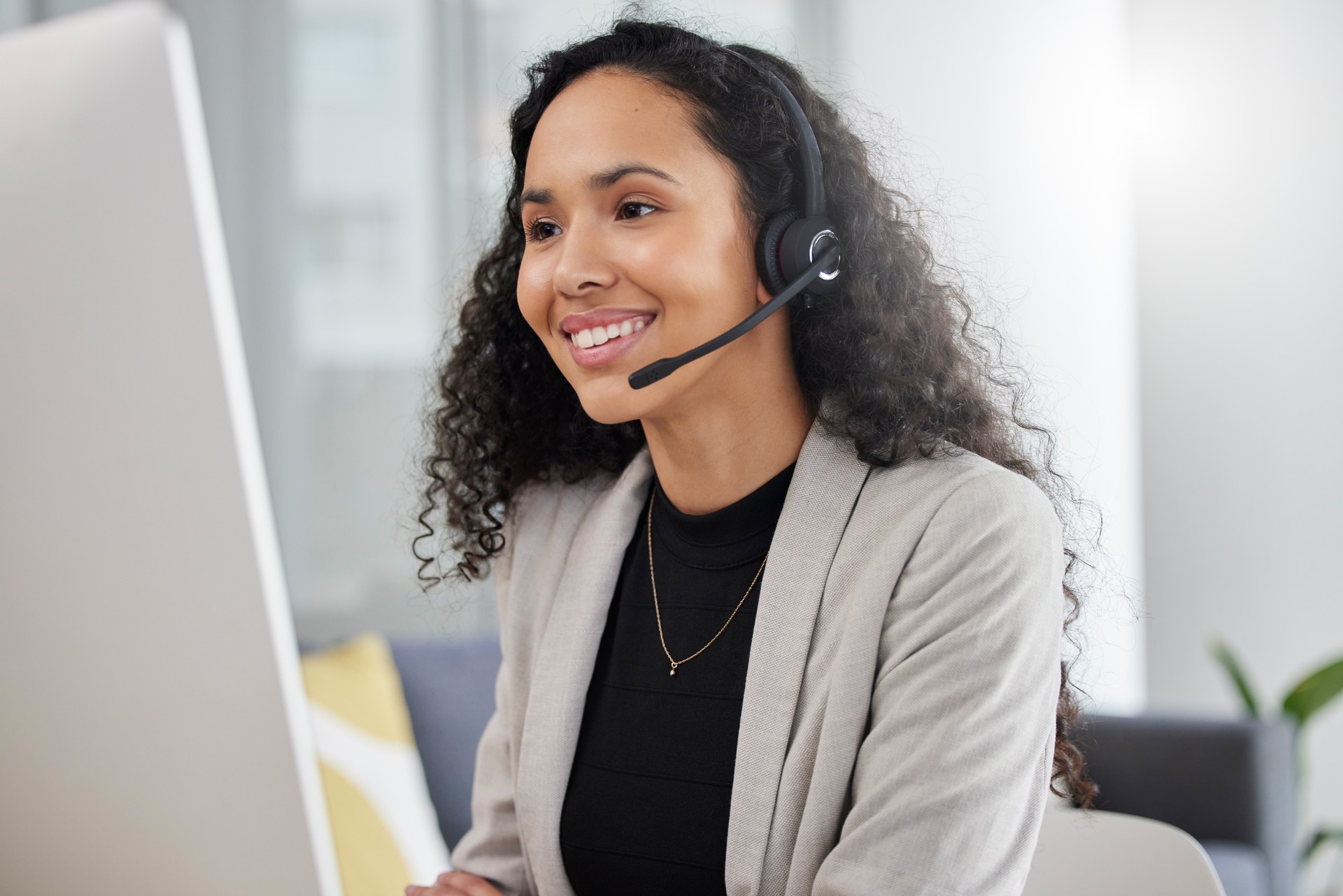 Customer service, call center and happy consultant or woman speaking online for technical support, advice or help. Employee, talking and consulting person In Brazil working in crm for tech startup